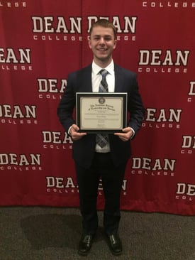 NSLS student posing with a diploma