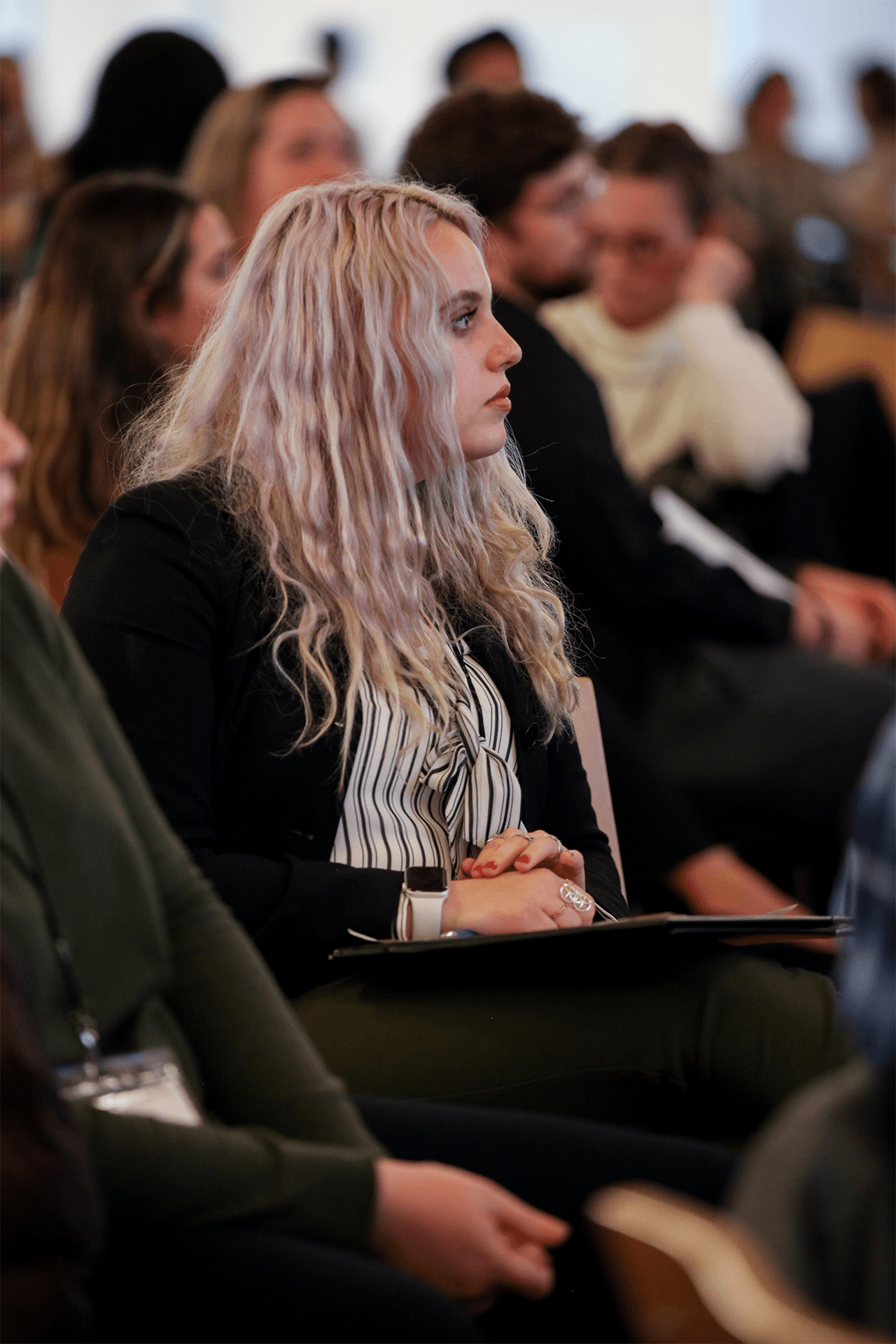 NSLS student listening at a speaking event